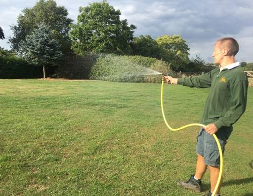 Watering lawn with hose
